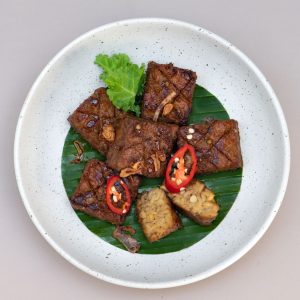 Maple glazed tempeh served at THIS IS BALI restaurant in Ubud, combining sweet and savory Indonesian flavors at one of the best restaurants in Ubud