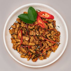 Crispy crunchy tempeh served at THIS IS BALI restaurant in Ubud, a delicious plant-based Indonesian food option from one of the best restaurants in Ubud