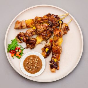 Grilled chicken satay served at THIS IS BALI restaurant in Ubud, a traditional Indonesian favorite from one of the best restaurants in Ubud