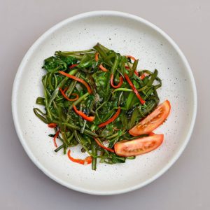 Lemony spinach served at THIS IS BALI restaurant in Ubud, a fresh and healthy Indonesian-inspired side dish from one of the best restaurants in Ubud