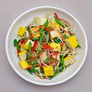 Sprouts and tofu dish served at THIS IS BALI restaurant in Ubud, offering a healthy plant-based option from one of the best restaurants in Ubud