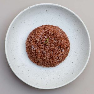 Steamed organic red rice served at THIS IS BALI restaurant in Ubud, a healthy and traditional Indonesian food option from one of the best restaurants in Ubud