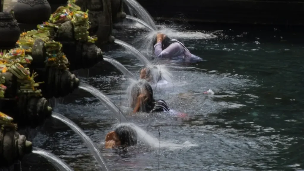 Balinese water purification ceremony Melukat at holy spring temple – one of the unique things to do in Ubud.