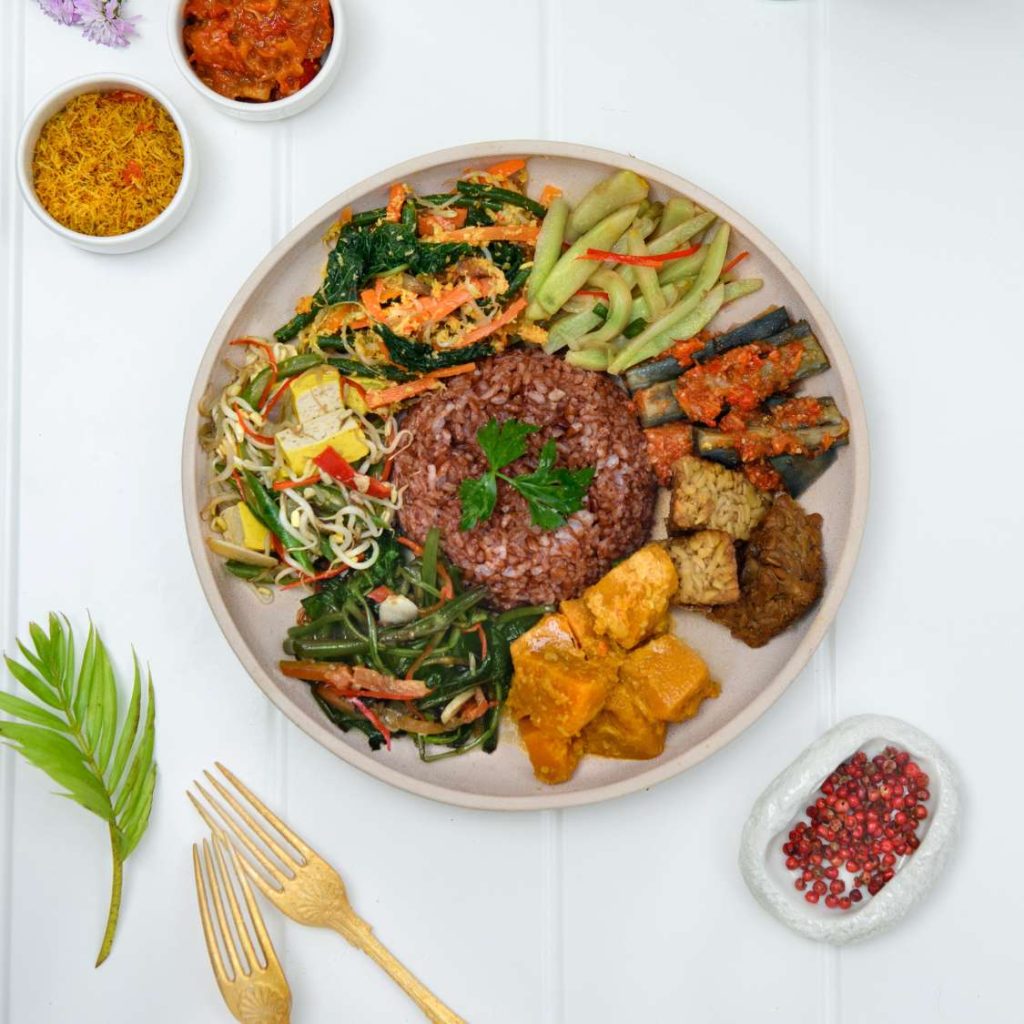 Colorful plate of nasi campur served at THIS IS BALI, best Indonesian restaurant in Ubud